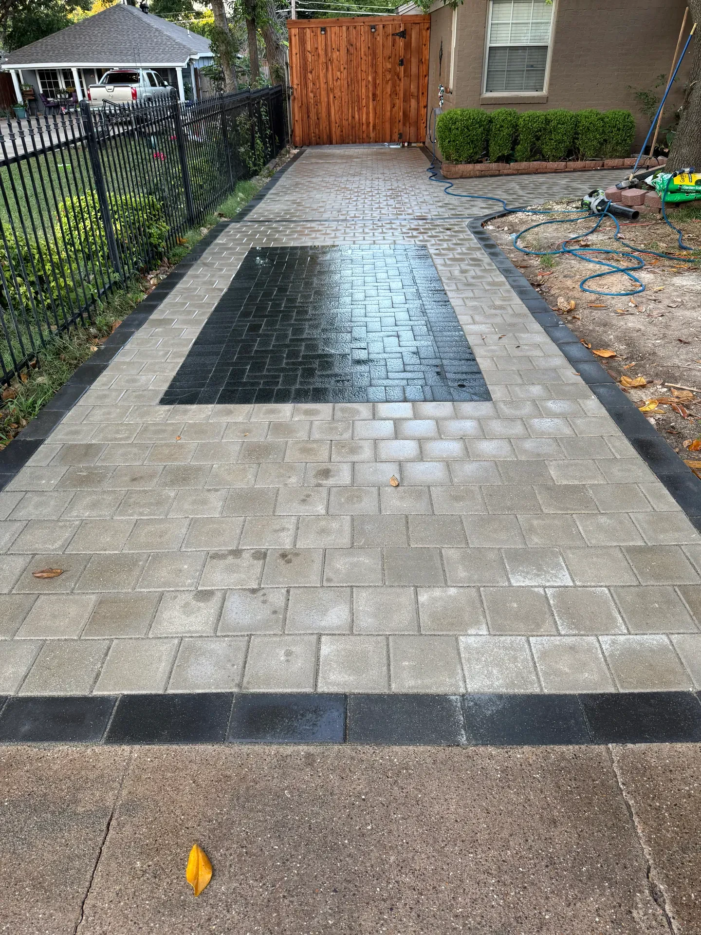 completed paver driveway with dark inset